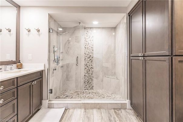 Bathroom, Glass Shower, Interior, Marble Walls, Recessed Lighting, Wood Texture Flooring