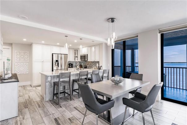 Dining room, Interior, Kitchen, Pendant Lights, Recessed Lighting, Stainless Steel Appliances, Water, Wood Texture Flooring