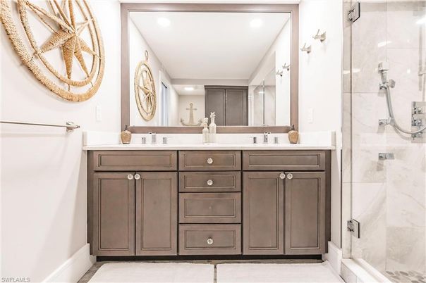 Bathroom, Dual Sink Vanities, Glass Shower, Interior, Marble Walls, Recessed Lighting