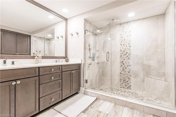 Bathroom, Dual Sink Vanities, Glass Shower, Interior, Marble Walls, Recessed Lighting