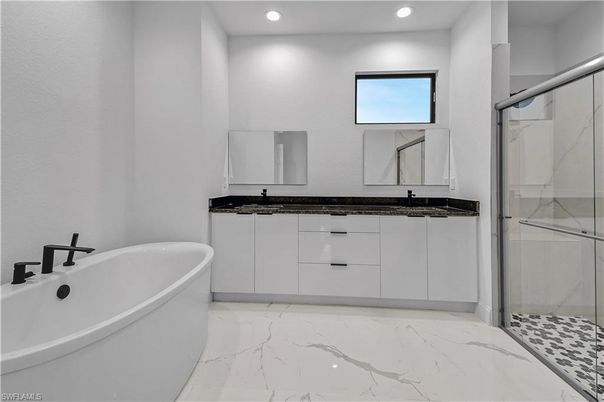 Bathroom, Dual Sink Vanities, Free Standing Baths, Glass Shower, Interior, Marble, Recessed Lighting