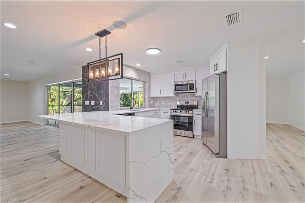 Interior, Kitchen, Pendant Lights, Recessed Lighting, Stainless Steel Appliances, Wood Texture Flooring