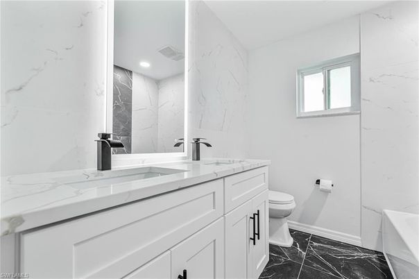 Bathroom, Dual Sink Vanities, Interior, Marble, Marble Walls, Recessed Lighting