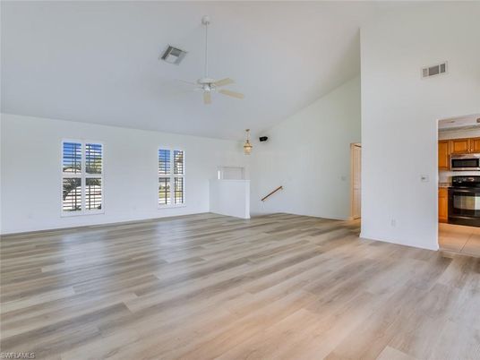 Empty room, Interior, Kitchen, Stainless Steel Appliances, Wood Texture Flooring