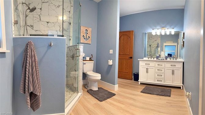 Bathroom, Glass Shower, Interior, Marble Walls, Wood Texture Flooring
