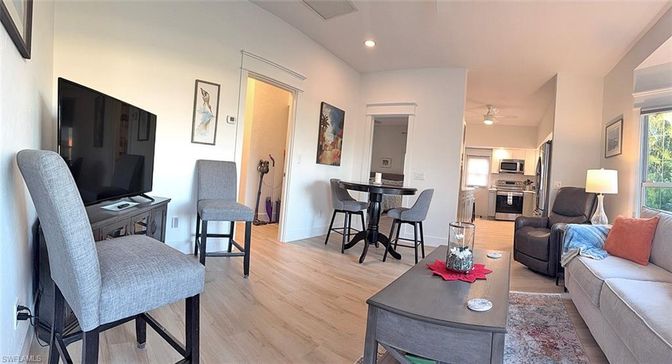 Dining room, Interior, Kitchen, Living room, Recessed Lighting, Stainless Steel Appliances, Wood Texture Flooring