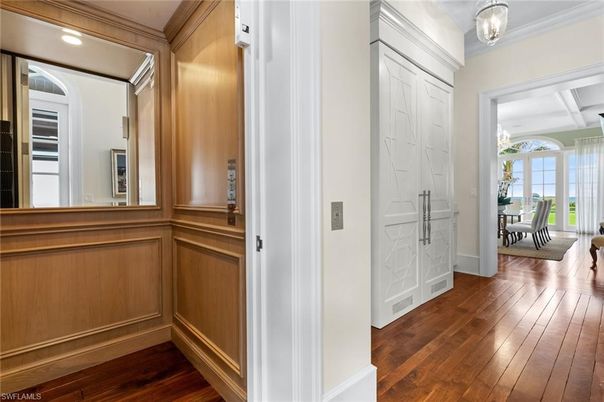 Dining room, Elevator, Interior, Recessed Lighting, Wood Texture Flooring, Wooden Walls