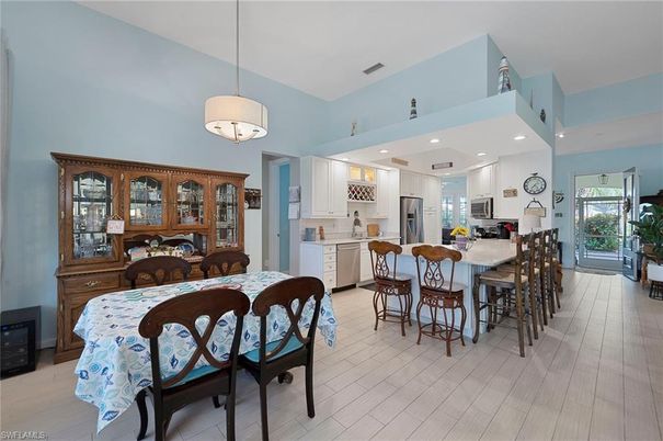Dining room, Interior, Kitchen, Pendant Lights, Recessed Lighting, Stainless Steel Appliances, Wood Texture Flooring