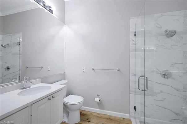 Bathroom, Glass Shower, Interior, Marble Walls, Wood Texture Flooring
