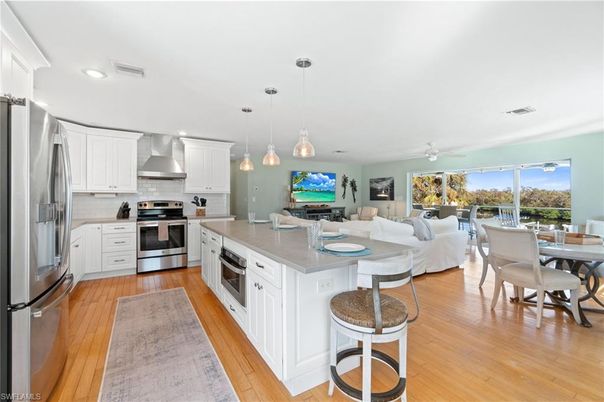 Dining room, Interior, Kitchen, Living room, Pendant Lights, Recessed Lighting, Stainless Steel Appliances, Wood Texture Flooring