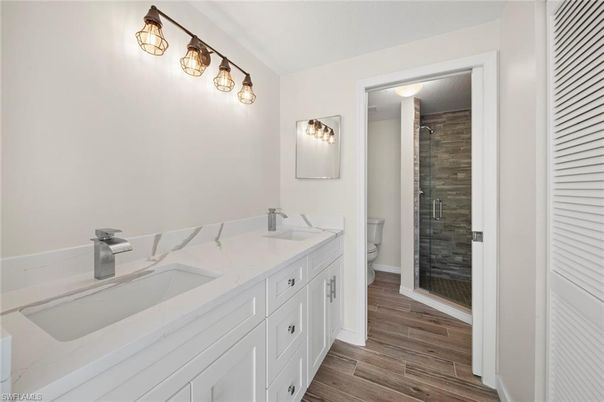 Bathroom, Dual Sink Vanities, Glass Shower, Interior, Wood Texture Flooring