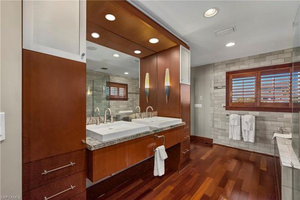 Bathroom, Dual Sink Vanities, Glass Shower, Interior, Recessed Lighting, Wood Texture Flooring