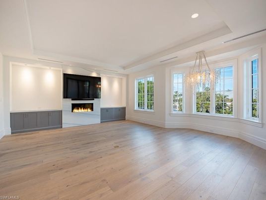 Chandelier, Empty room, Fireplace, Interior, Recessed Lighting, Wood Texture Flooring