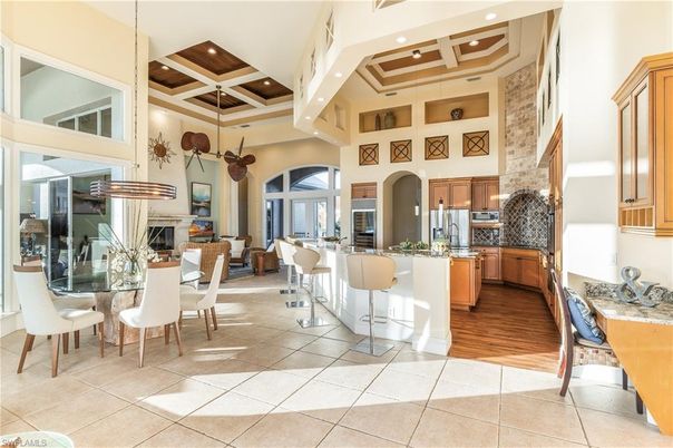 Dining room, Fireplace, Interior, Kitchen, Pendant Lights, Recessed Lighting, Stainless Steel Appliances, Wood Texture Flooring