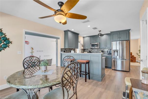 Dining room, Interior, Kitchen, Recessed Lighting, Stainless Steel Appliances, Wood Texture Flooring