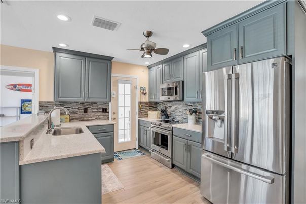 Interior, Kitchen, Recessed Lighting, Stainless Steel Appliances, Wood Texture Flooring