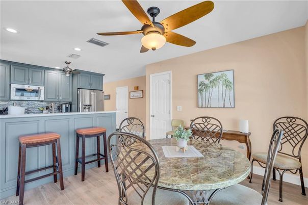Dining room, Interior, Kitchen, Recessed Lighting, Stainless Steel Appliances, Wood Texture Flooring