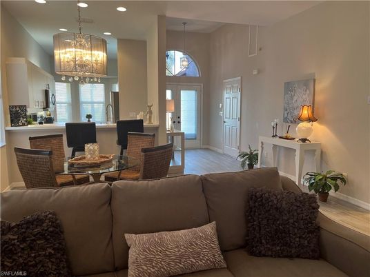 Chandelier, Dining room, Fireplace, Interior, Living room, Pendant Lights, Recessed Lighting, Wood Texture Flooring