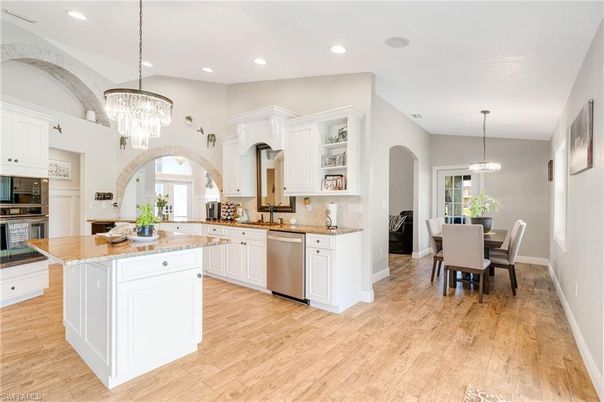 Chandelier, Dining room, Interior, Kitchen, Pendant Lights, Recessed Lighting, Stainless Steel Appliances, Wood Texture Flooring