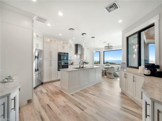 Dining room, Interior, Kitchen, Living room, Pendant Lights, Recessed Lighting, Stainless Steel Appliances, Wood Texture Flooring