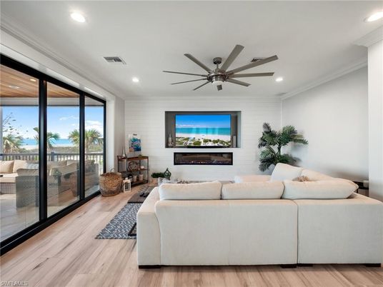 Fireplace, Interior, Living room, Recessed Lighting, Water, Wood Texture Flooring