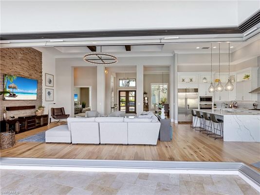 Interior, Kitchen, Living room, Pendant Lights, Recessed Lighting, Stainless Steel Appliances, Stone Walls, Wood Texture Flooring