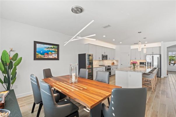 Dining room, Interior, Kitchen, Pendant Lights, Recessed Lighting, Stainless Steel Appliances, Wood Texture Flooring