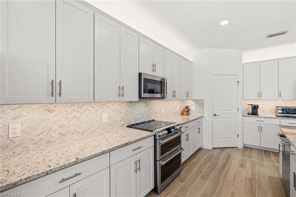 Interior, Kitchen, Recessed Lighting, Stainless Steel Appliances, Wood Texture Flooring