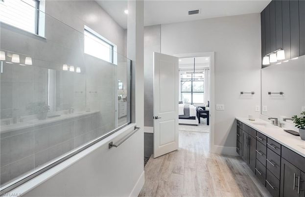Bathroom, Bedroom, Glass Shower, Interior, Recessed Lighting, Wood Texture Flooring