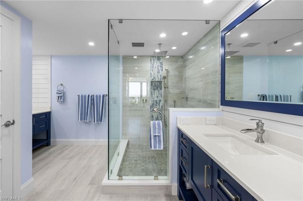 Bathroom, Chandelier, Glass Shower, Interior, Recessed Lighting, Wood Texture Flooring