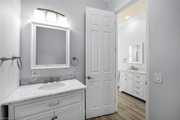Bathroom, Dual Sink Vanities, Interior, Recessed Lighting, Wood Texture Flooring