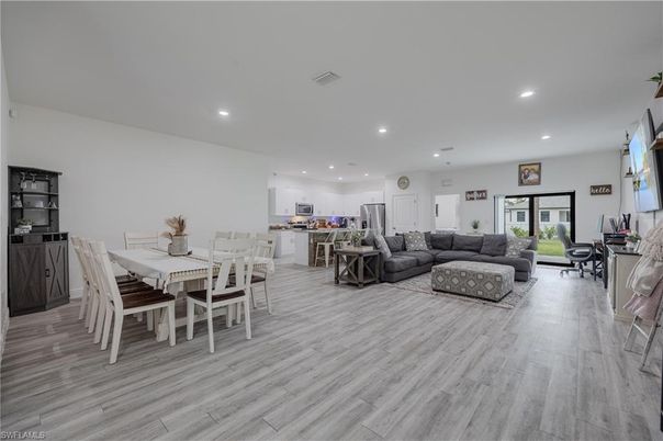 Dining room, Interior, Kitchen, Living room, Recessed Lighting, Stainless Steel Appliances, Wood Texture Flooring