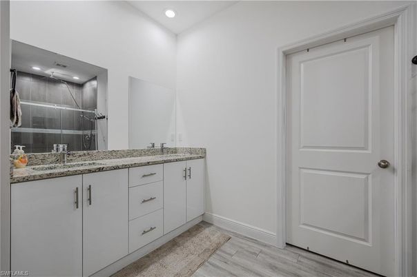 Bathroom, Dual Sink Vanities, Interior, Recessed Lighting, Wood Texture Flooring