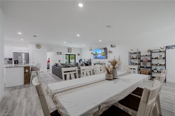 Dining room, Interior, Kitchen, Living room, Recessed Lighting, Stainless Steel Appliances, Wood Texture Flooring