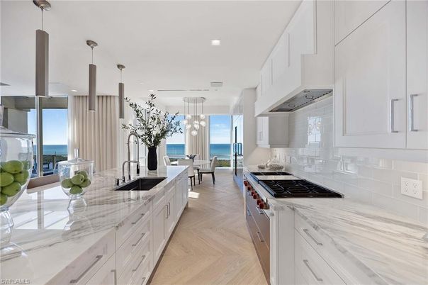 Dining room, Interior, Kitchen, Pendant Lights, Recessed Lighting, Stainless Steel Appliances, Water, Wood Texture Flooring