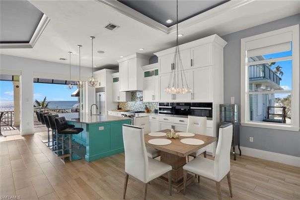 Dining room, Interior, Kitchen, Pendant Lights, Recessed Lighting, Stainless Steel Appliances, Water, Wood Texture Flooring