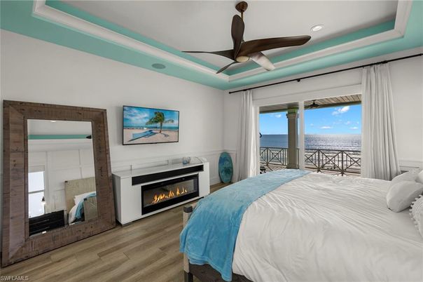 Bedroom, Fireplace, Interior, Recessed Lighting, Water, Wood Texture Flooring