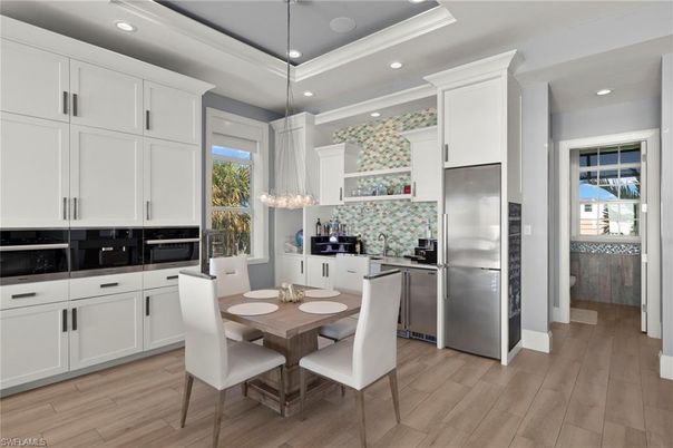 Dining room, Interior, Kitchen, Pendant Lights, Recessed Lighting, Stainless Steel Appliances, Wood Texture Flooring