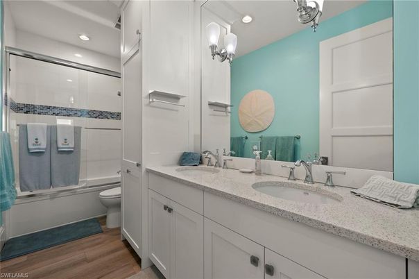 Bathroom, Dual Sink Vanities, Glass Shower, Interior, Recessed Lighting, Wood Texture Flooring