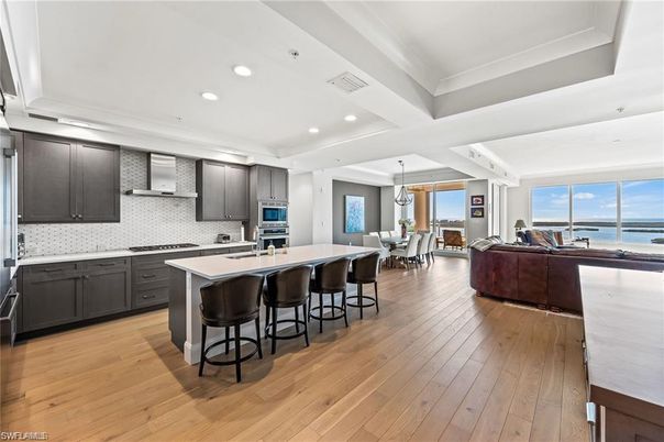 Dining room, Interior, Kitchen, Living room, Pendant Lights, Recessed Lighting, Stainless Steel Appliances, Water, Wood Texture Flooring