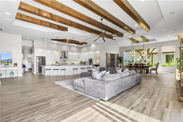 Dining room, Interior, Kitchen, Living room, Pendant Lights, Recessed Lighting, Stainless Steel Appliances, Wooden Beams, Wood Texture Flooring