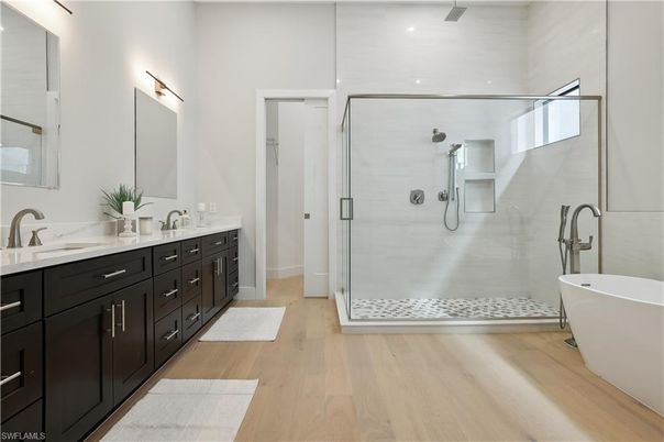 Bathroom, Dual Sink Vanities, Free Standing Baths, Glass Shower, Interior, Recessed Lighting, Wood Texture Flooring