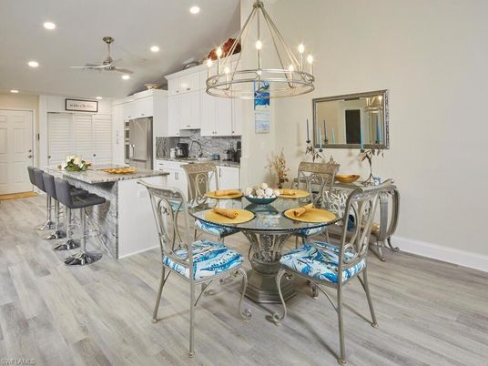 Chandelier, Dining room, Interior, Kitchen, Pendant Lights, Recessed Lighting, Stainless Steel Appliances, Wood Texture Flooring