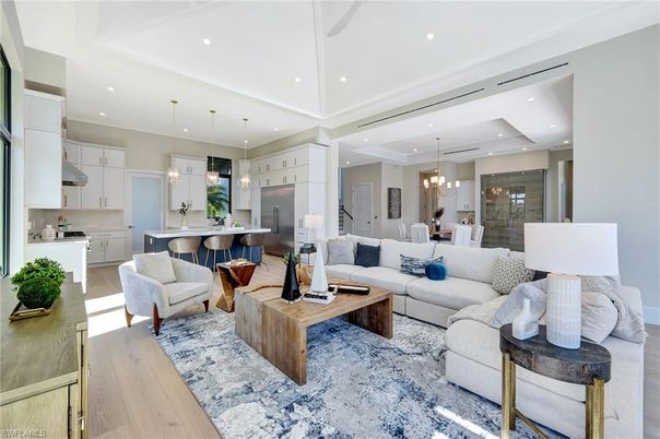 Chandelier, Dining room, Interior, Kitchen, Living room, Pendant Lights, Recessed Lighting, Stainless Steel Appliances, Wood Texture Flooring