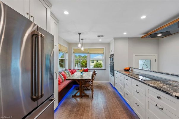 Dining room, Interior, Kitchen, Pendant Lights, Recessed Lighting, Stainless Steel Appliances, Wood Texture Flooring