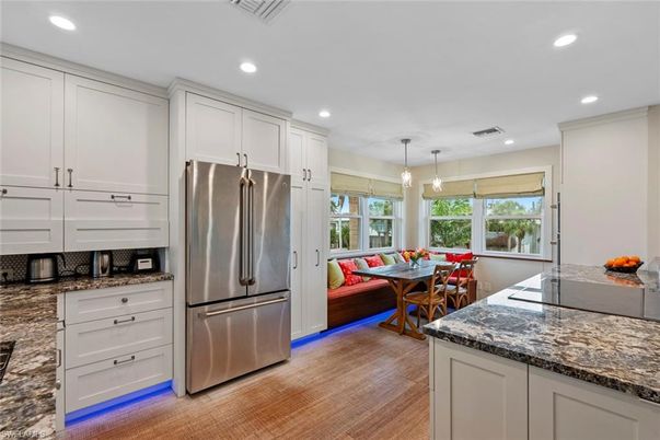Dining room, Interior, Kitchen, Pendant Lights, Recessed Lighting, Stainless Steel Appliances, Wood Texture Flooring