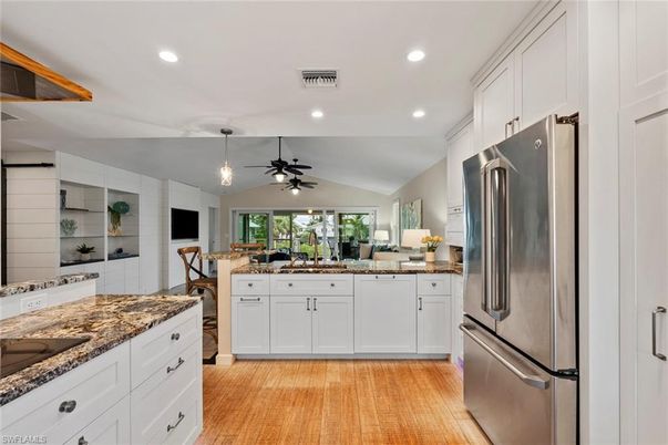 Dining room, Interior, Kitchen, Pendant Lights, Recessed Lighting, Stainless Steel Appliances, Wood Texture Flooring