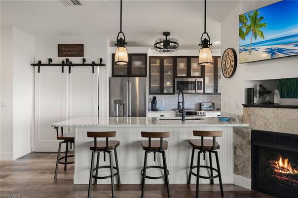 Fireplace, Interior, Kitchen, Pendant Lights, Stainless Steel Appliances, Wood Texture Flooring