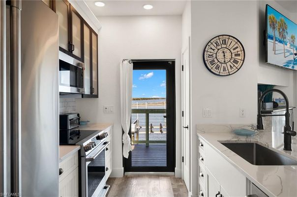 Interior, Kitchen, Recessed Lighting, Stainless Steel Appliances, Water, Wood Texture Flooring
