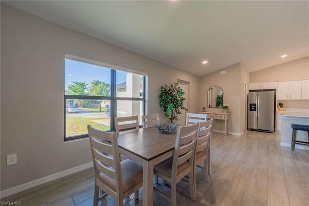 Dining room, Interior, Kitchen, Recessed Lighting, Stainless Steel Appliances, Wood Texture Flooring